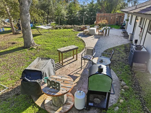 a view of yard with patio