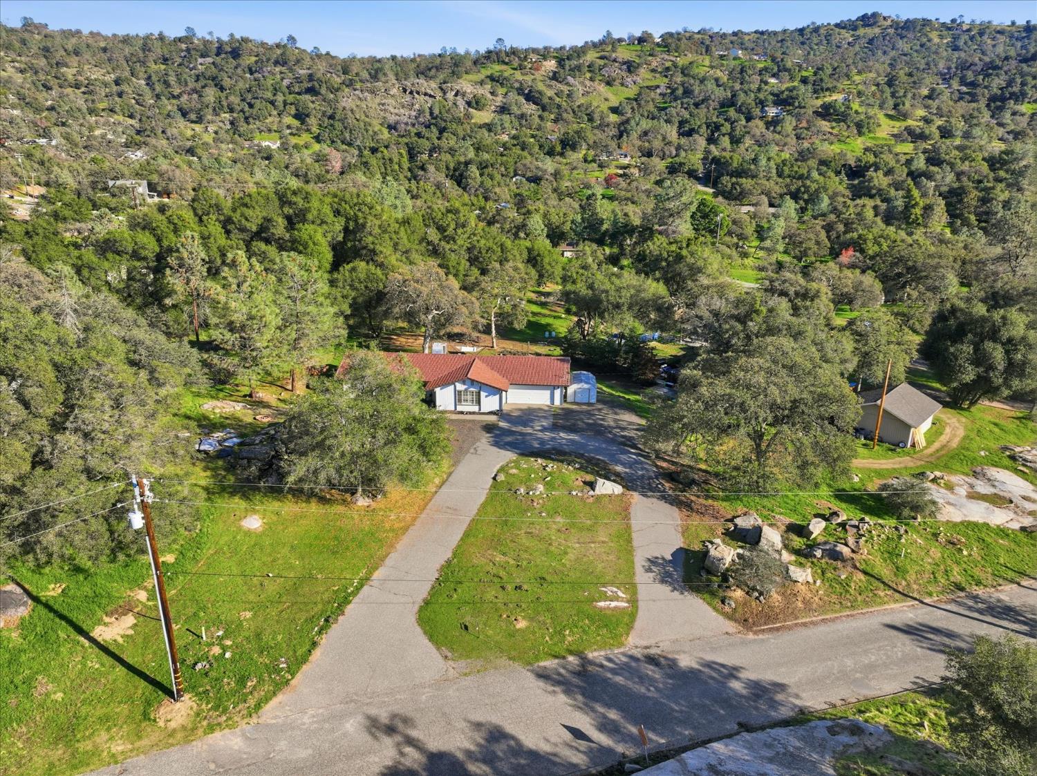 31083 Moccassin Court Coarsegold, CA 93614 - Photo 4 of 42 a view of a yard with an outdoor space