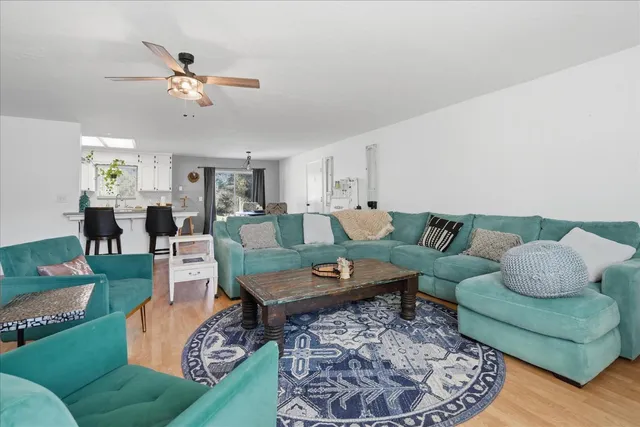 a living room with furniture and a rug