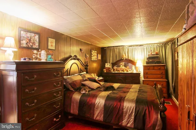 a bed room with a bed and a chair