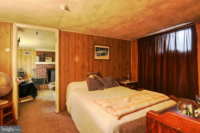 a bedroom with a bed and a walk in closet