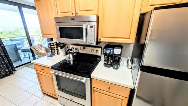 a kitchen with a stove and a microwave