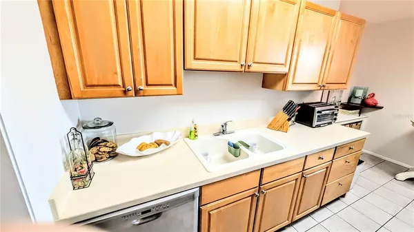 a utility room with sink dryer and washer