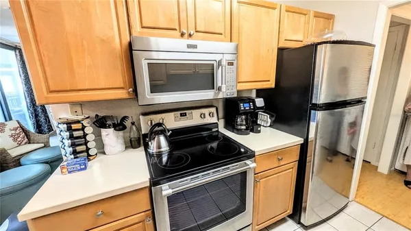 a kitchen with a stove microwave and refrigerator