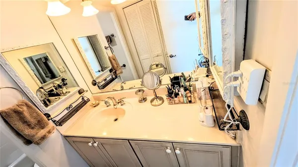 a bathroom with a toilet and a mirror