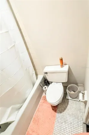 a view of a gym area with water heater and racks