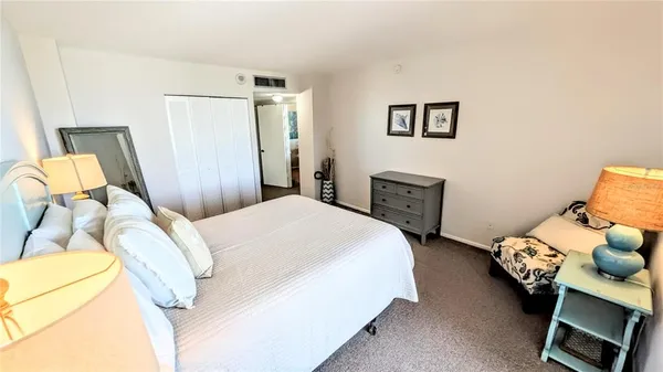 a bathroom with a sink mirror and toilet