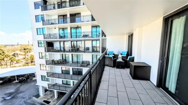 a view of swimming pool with chairs