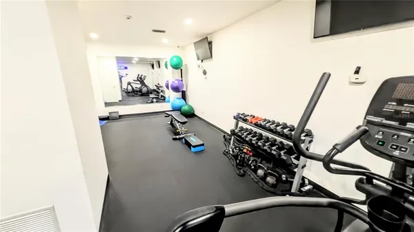 a view of a room with gym equipment