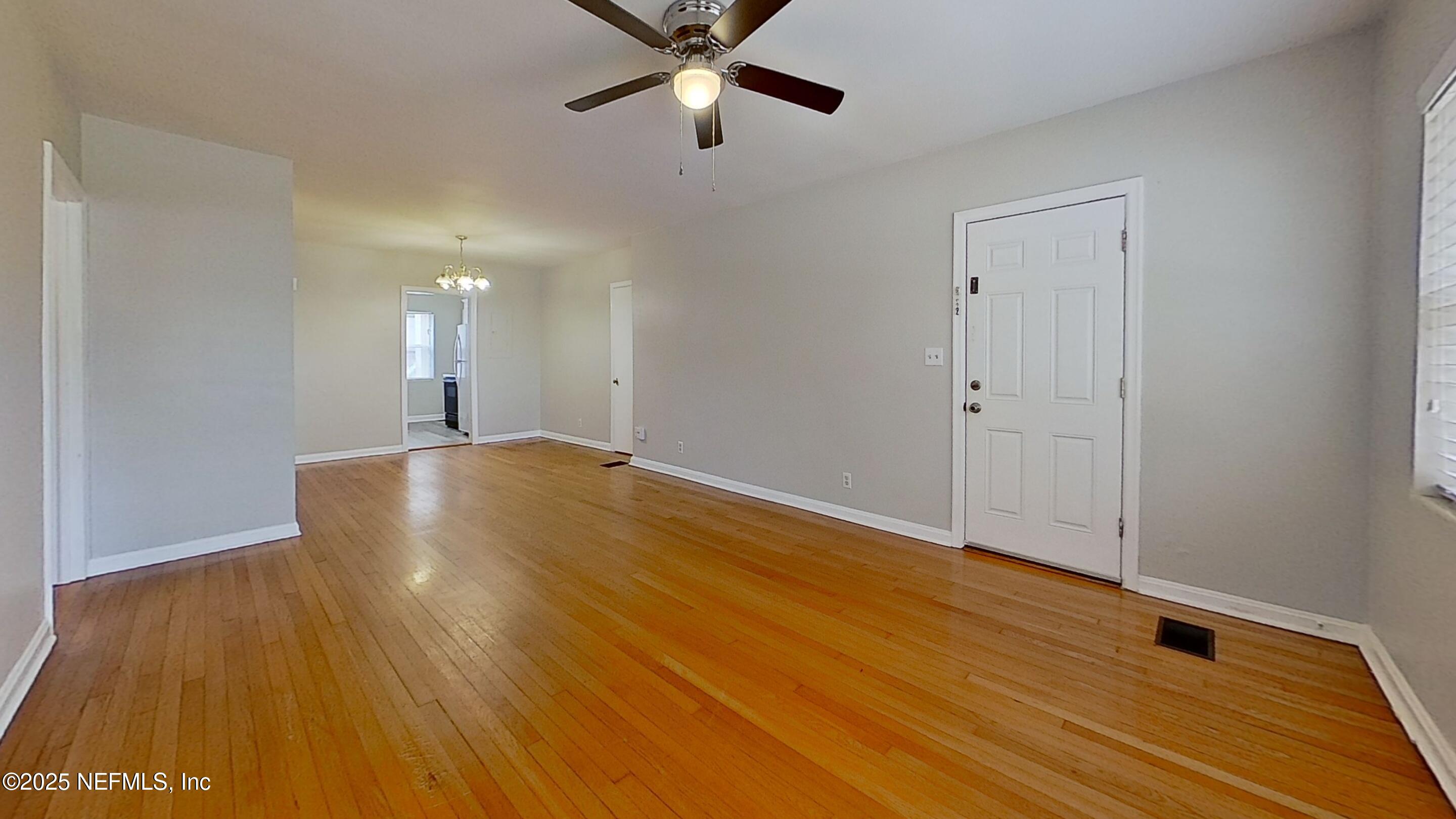 1543 Nicholson Road, Unit 1 Jacksonville, FL 32207 - Photo 6 of 16 a view of an empty room with wooden floor
