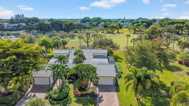 aerial view of a house with a lake view