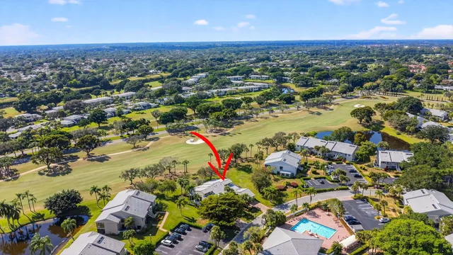 an aerial view of residential house with outdoor space and swimming pool