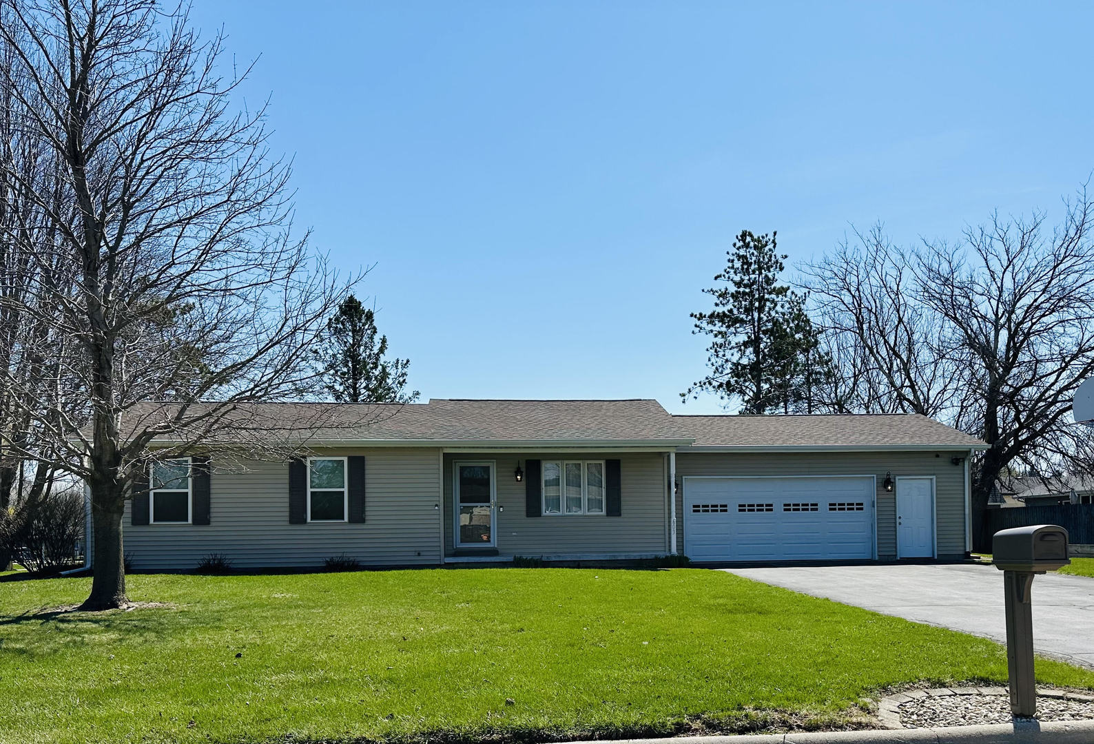 603 Fairview Street Durand, IL 61024 - Photo 1 of 21 a front view of a house with a yard and trees