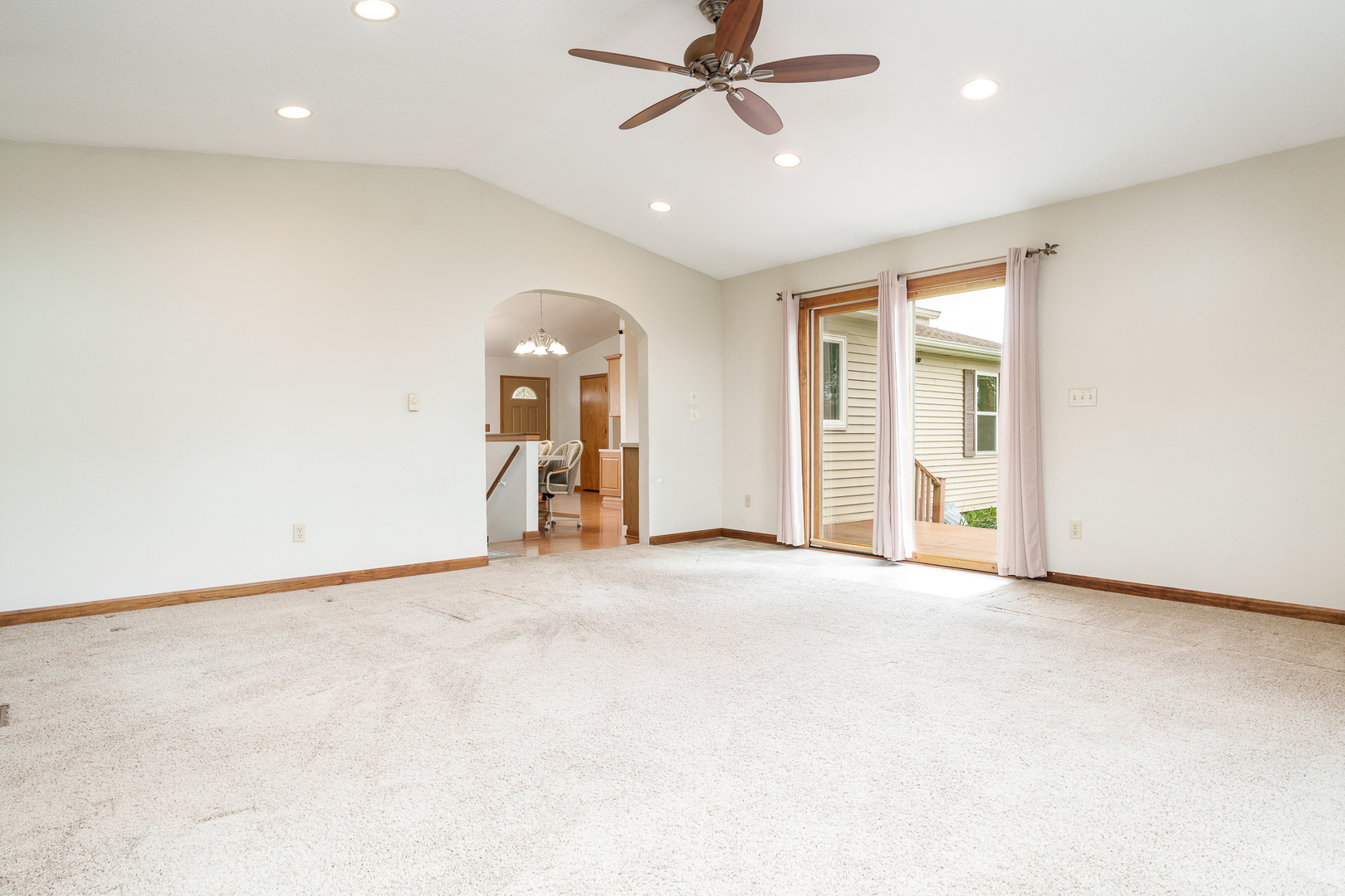 603 Fairview Street Durand, IL 61024 - Photo 12 of 21 an empty room with ceiling fan and windows