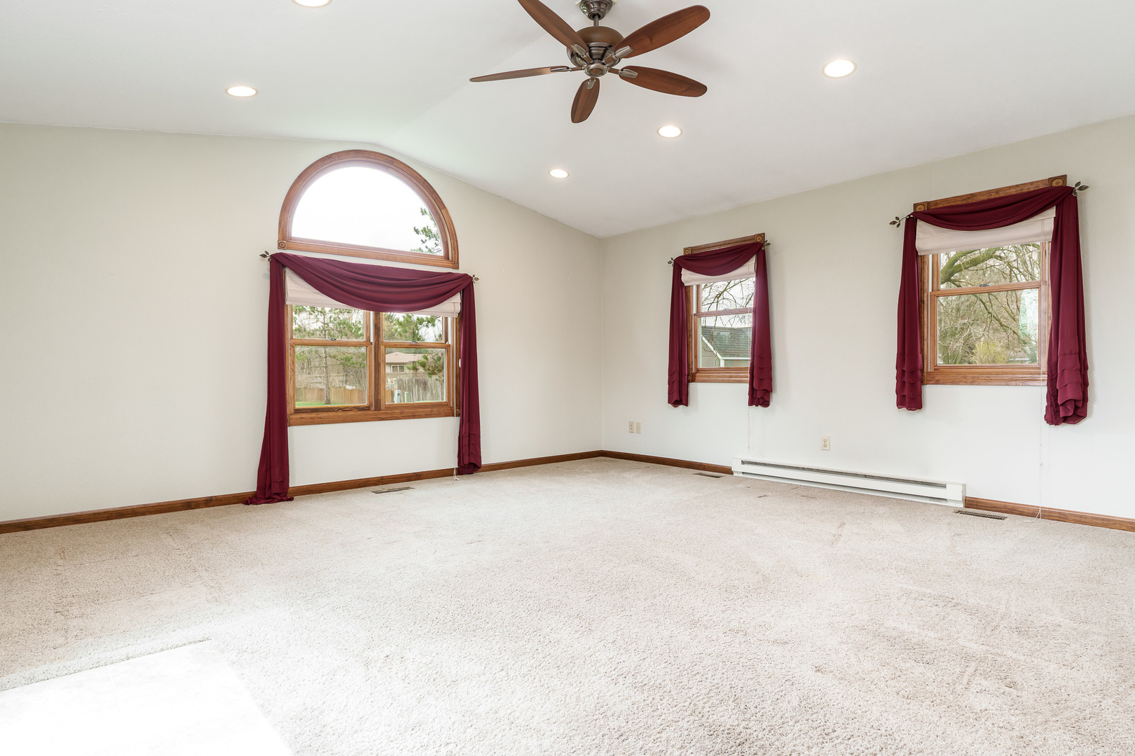 603 Fairview Street Durand, IL 61024 - Photo 10 of 21 an empty room with windows and fan