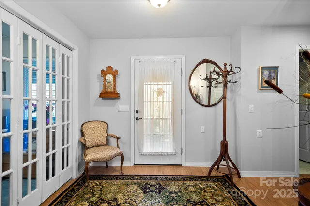 a front view of a house with wooden floor and windows