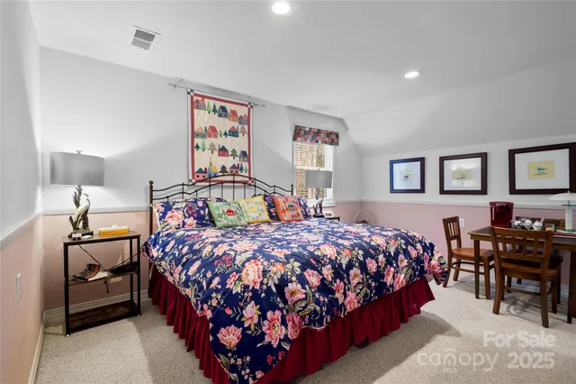 a bedroom with bed and a table