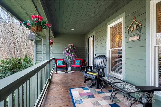 a view of a chairs and tables in the balcony