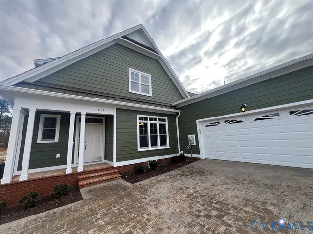 a front view of a house with a garage