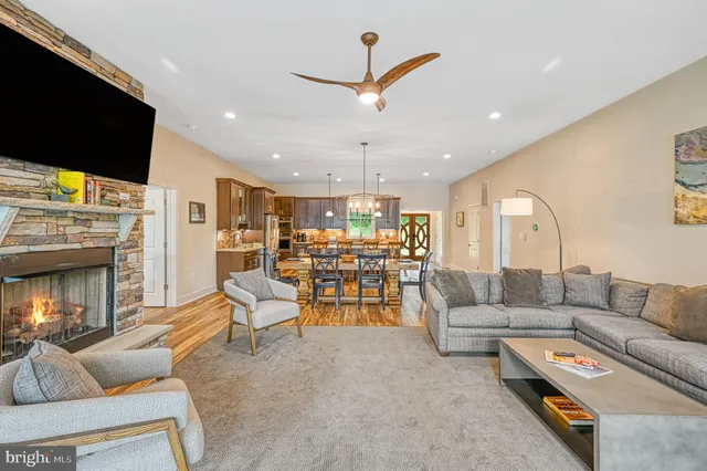 a spacious bathroom with a double vanity sink a mirror and a shower