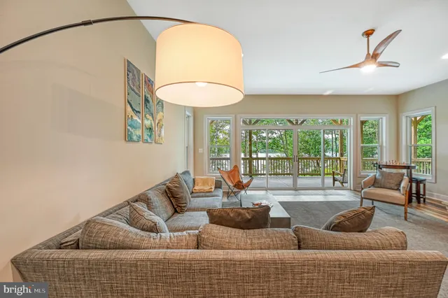 a spacious bedroom with a large bed and a large window