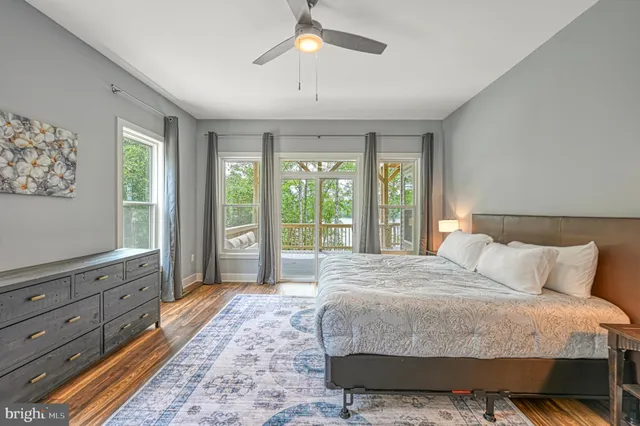 a living room with furniture a rug and a fireplace