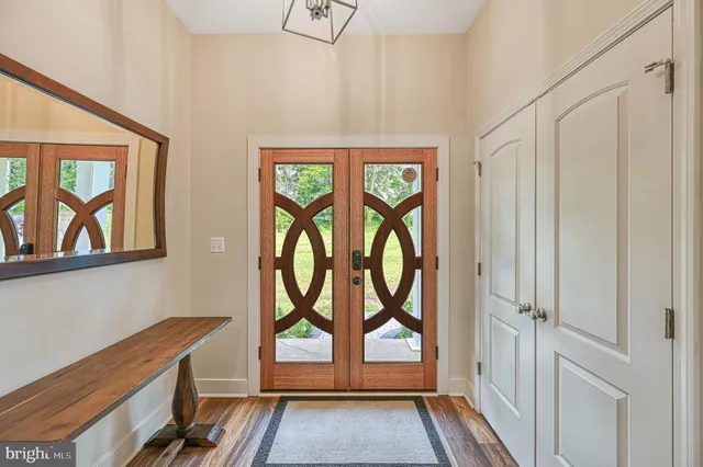 a view of a dining room with furniture wooden floor and chandelier