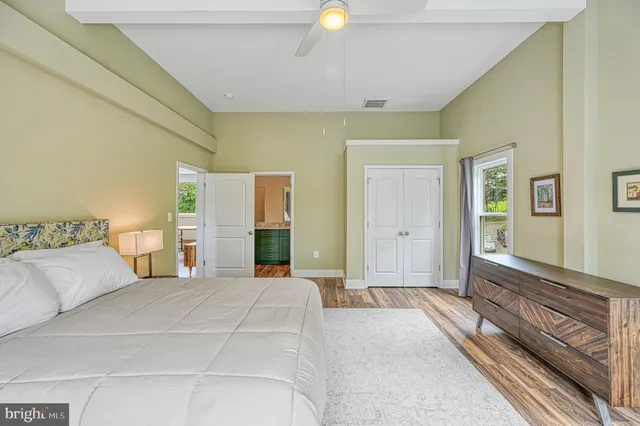 an aerial view of a houses with outdoor space and lake view