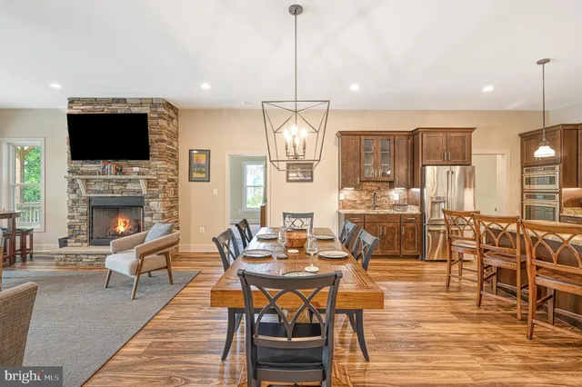 a living room with furniture fireplace and flat screen tv