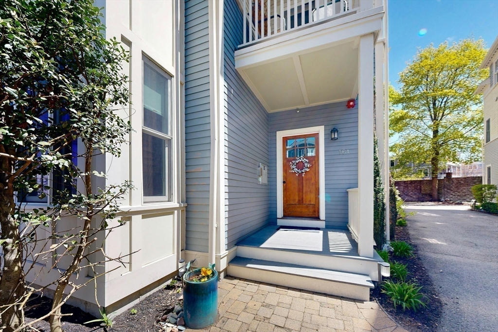 16 A Meehan Street, Unit 1 Boston, MA 02130 - Photo 15 of 16 a front view of a house with a porch