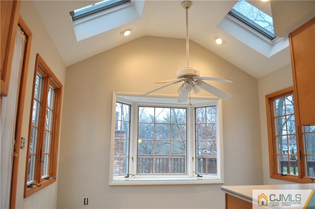 32 Nottingham Road Edison, NJ 08820 - Photo 16 of 25 a bedroom with a bed and a chandelier