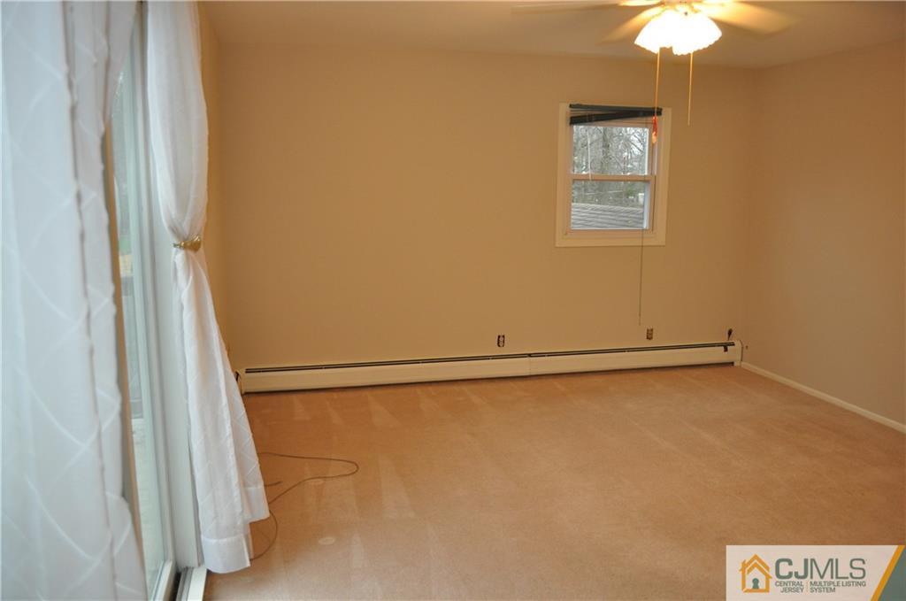 32 Nottingham Road Edison, NJ 08820 - Photo 18 of 25 a view of a room with a window and a fan