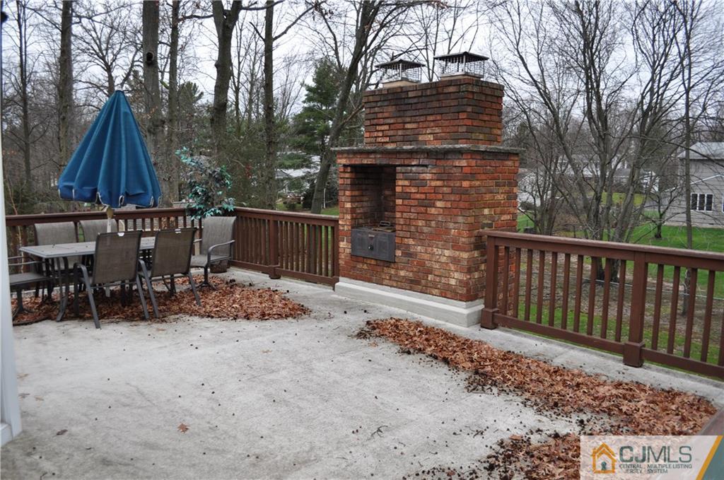 32 Nottingham Road Edison, NJ 08820 - Photo 21 of 25 a view of a chairs and table in the back yard