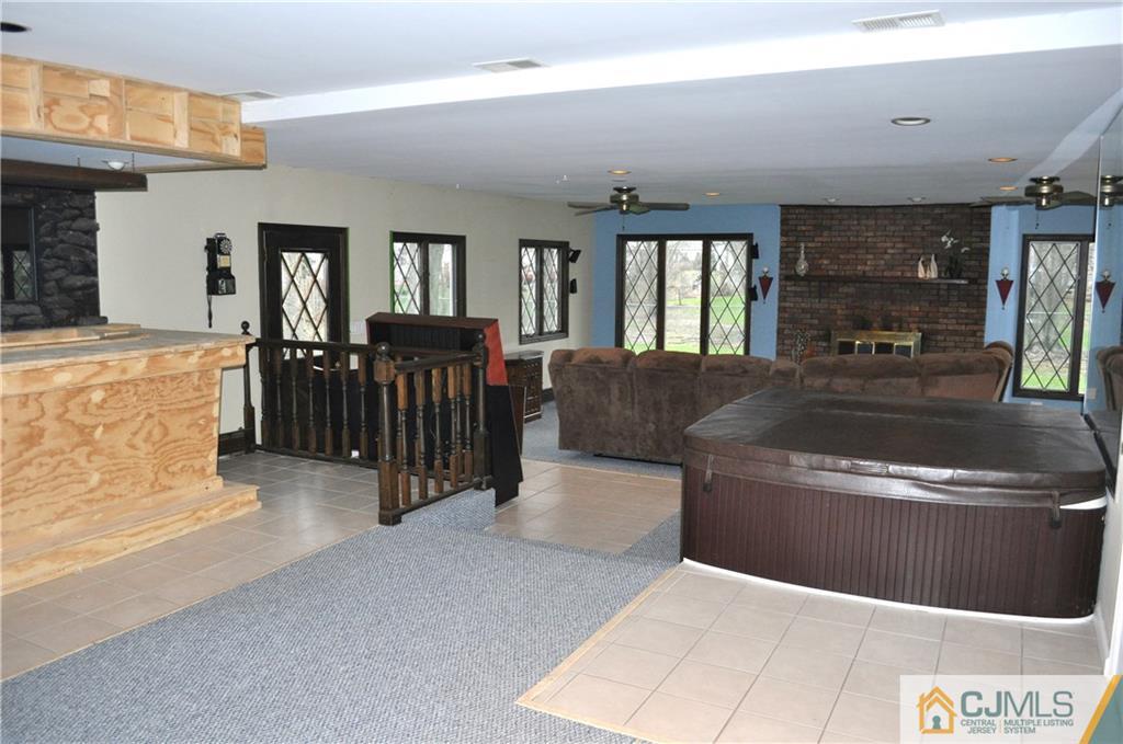 32 Nottingham Road Edison, NJ 08820 - Photo 22 of 25 a living room with furniture and a window