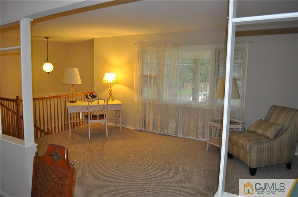 32 Nottingham Road Edison, NJ 08820 - Photo 10 of 25 a view of a livingroom with furniture and a window