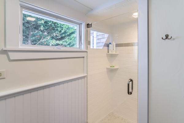 217 Barnes Road Oak Bluffs, MA 02557 - Photo 49 of 60 a bathroom with a shower and a window