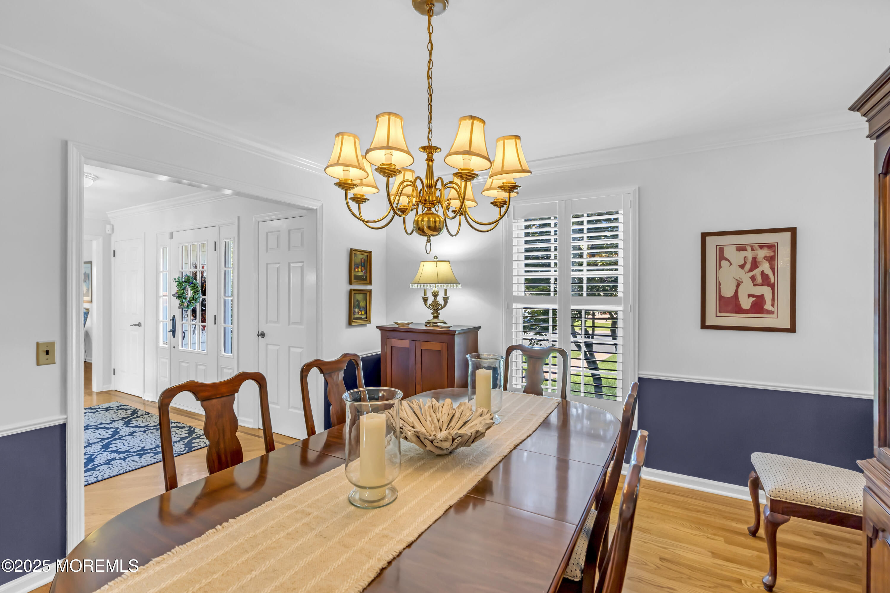 664 Valley Road Brielle, NJ 08730 - Photo 16 of 46 a view of a dining room with furniture a chandelier and wooden floor