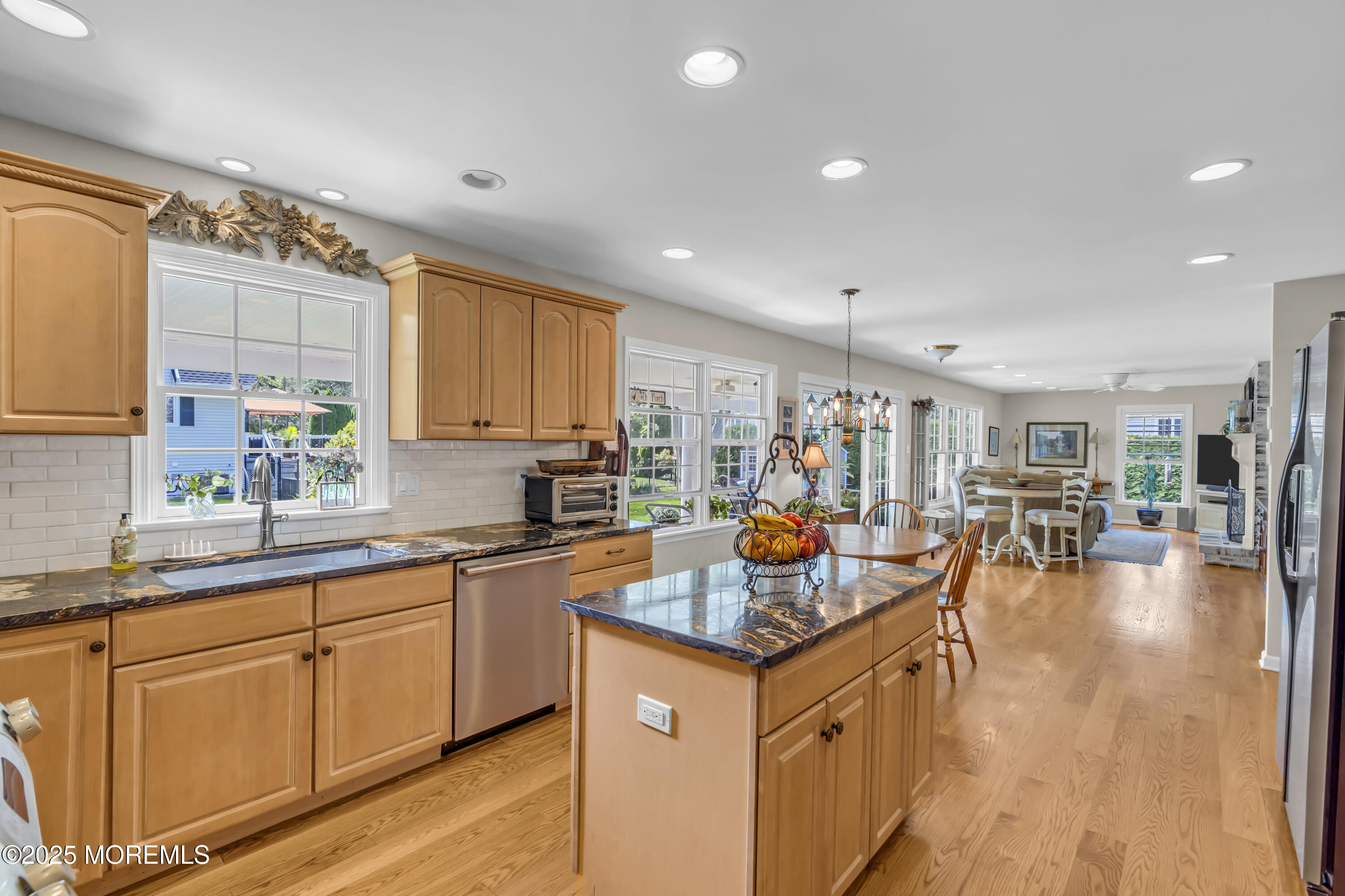 664 Valley Road Brielle, NJ 08730 - Photo 28 of 46 a kitchen with a sink stove and cabinets