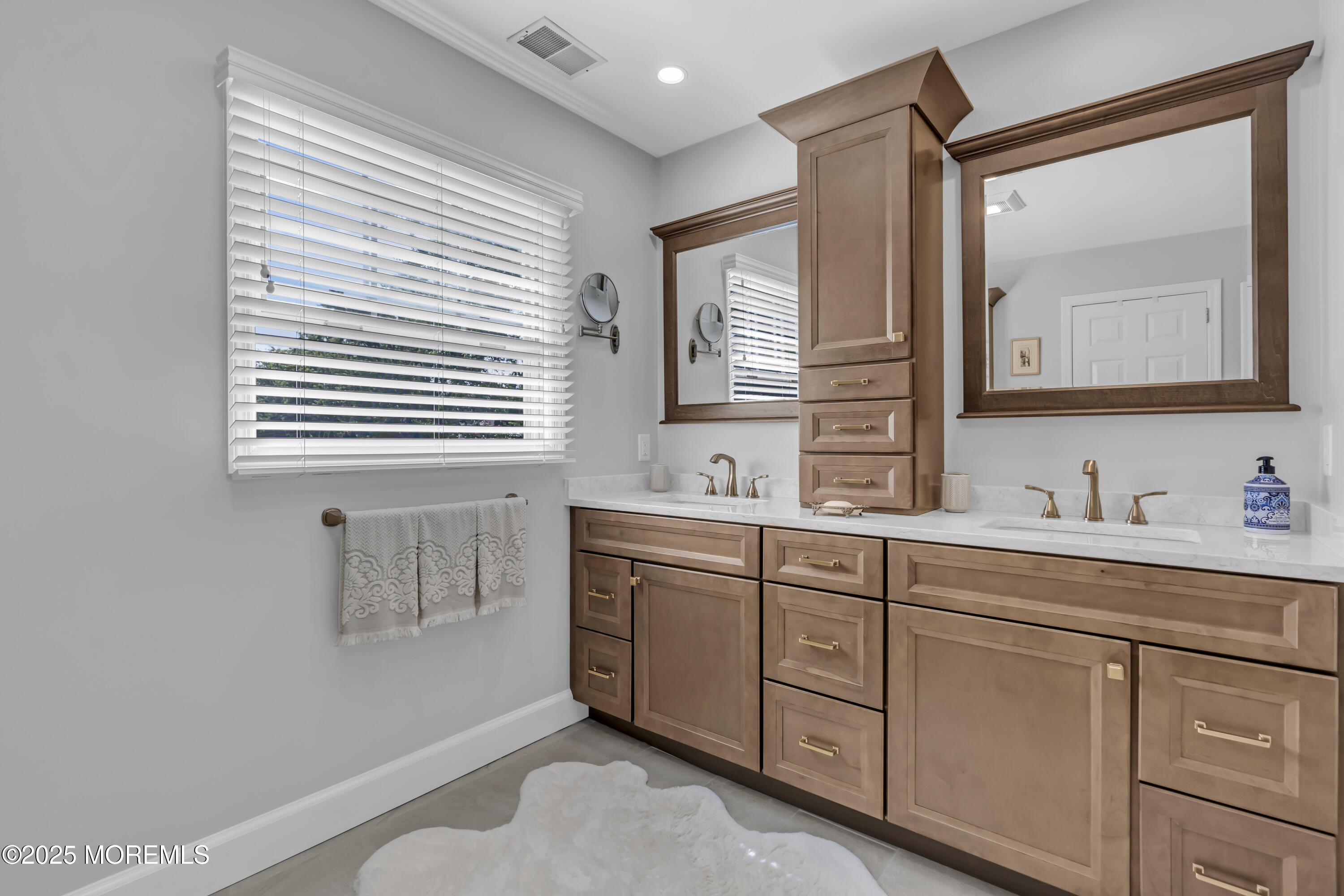 664 Valley Road Brielle, NJ 08730 - Photo 33 of 46 a bathroom with a sink mirror and a bathtub