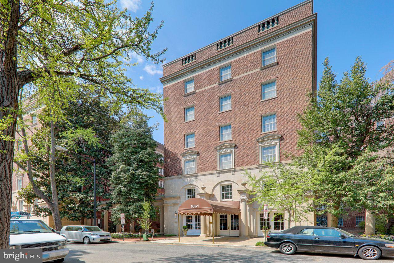 1661 Crescent Place Northwest, Unit 408 Washington, DC 20009 - Photo 11 of 57 Front Elevation with Lit Canopy Entrance