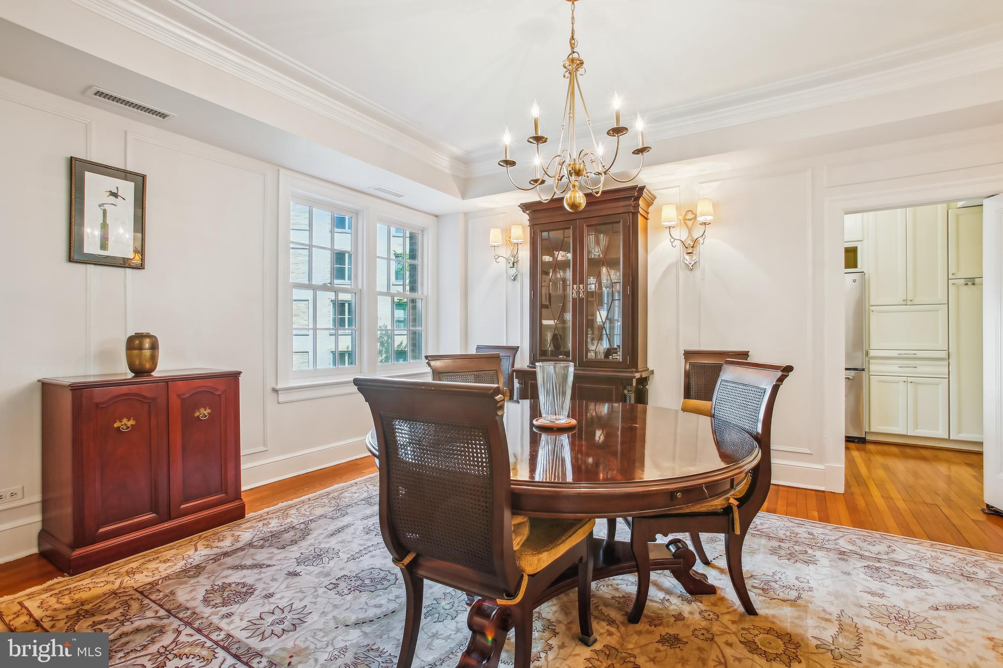1661 Crescent Place Northwest, Unit 408 Washington, DC 20009 - Photo 18 of 57 Formal Dining Room with 6 Lamp Brass Chandelier