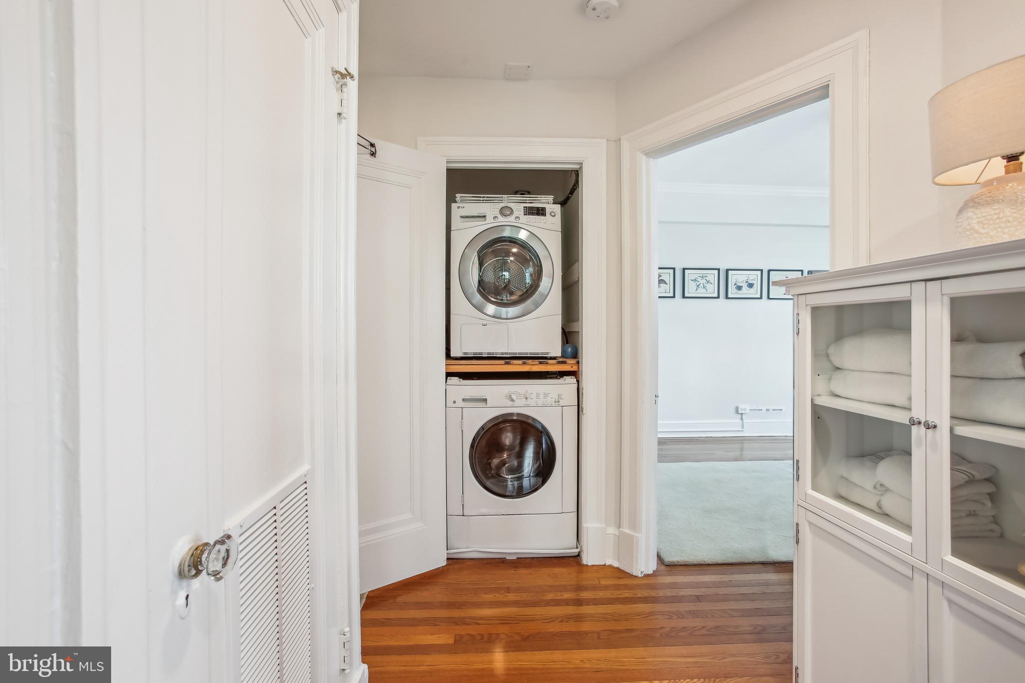 1661 Crescent Place Northwest, Unit 408 Washington, DC 20009 - Photo 32 of 57 Full Sized Front Loading Laundry Closet