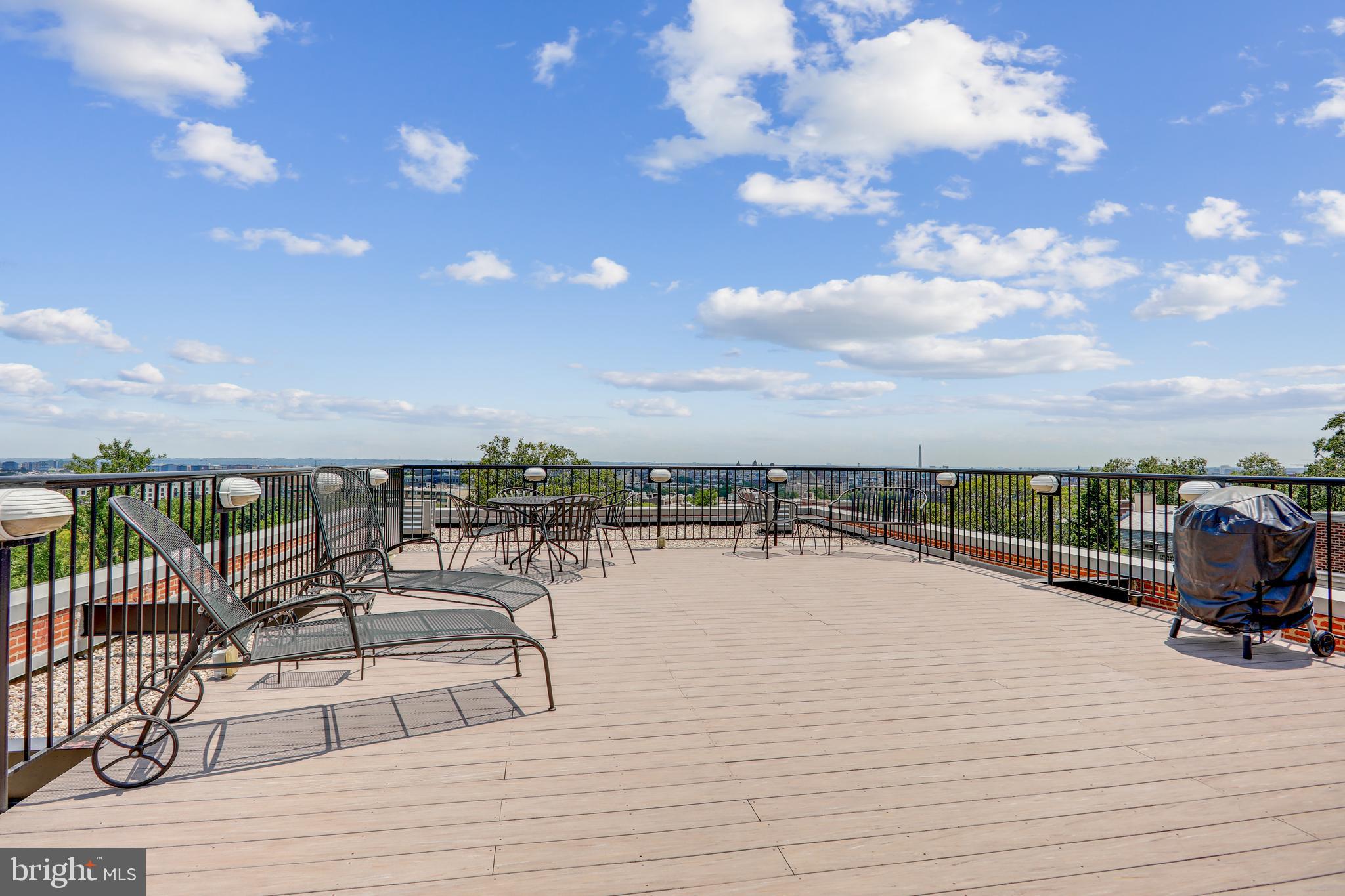 1661 Crescent Place Northwest, Unit 408 Washington, DC 20009 - Photo 45 of 57 Common Roof Deck with Wrought Iron Lounge