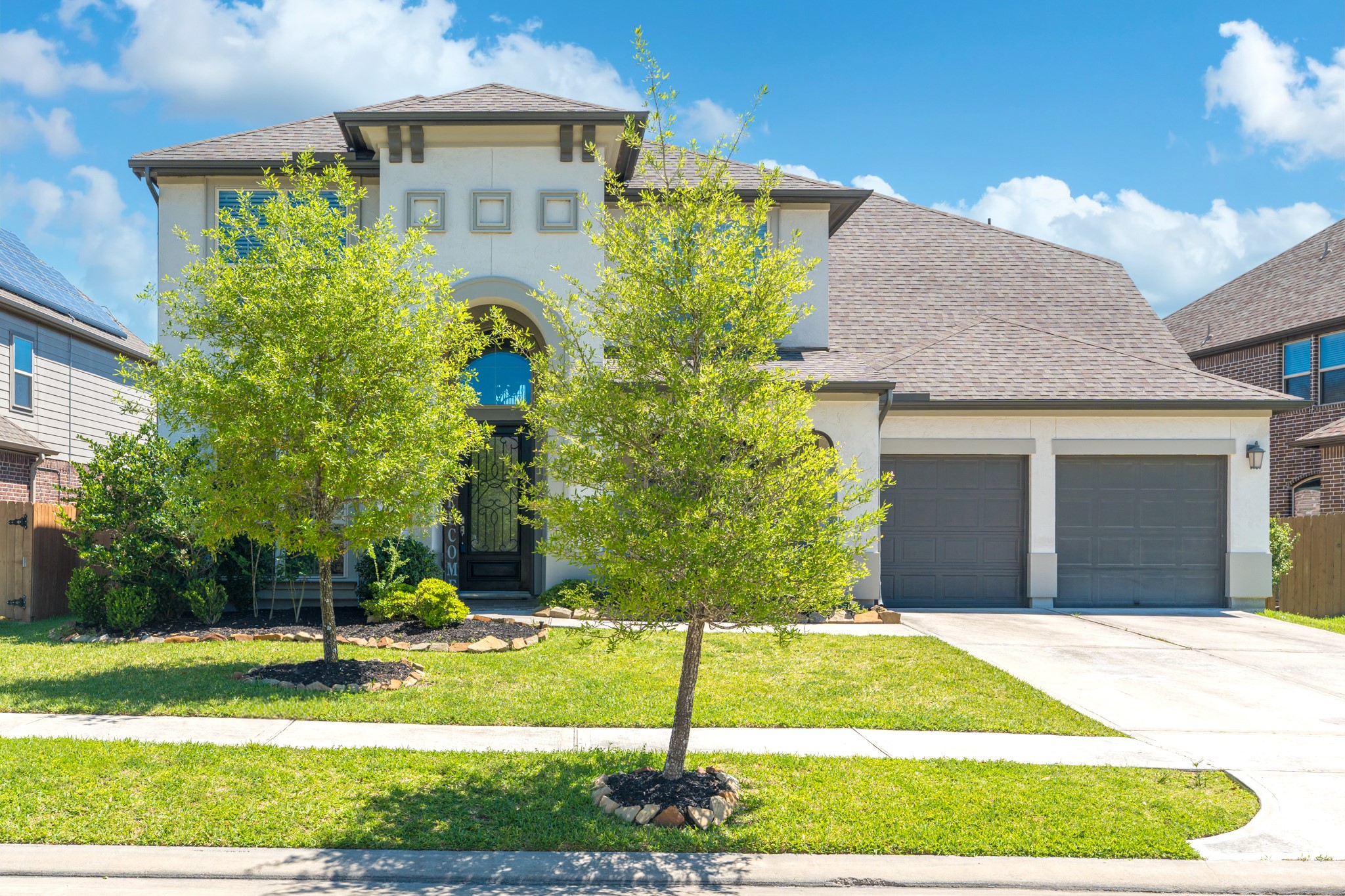 a front view of a house with a yard