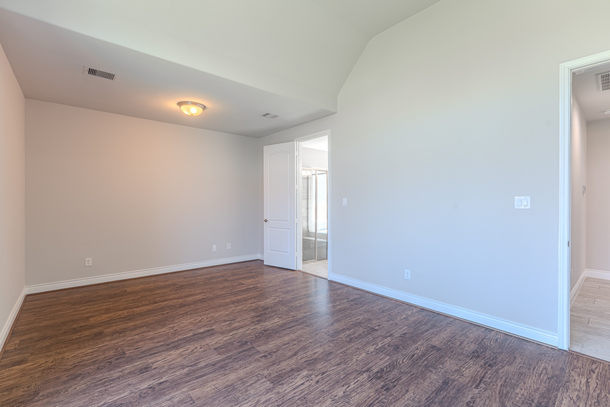27918 Madison Bend Drive Spring, TX 77386 - Photo 24 of 50 a view of an empty room with wooden floor and a window