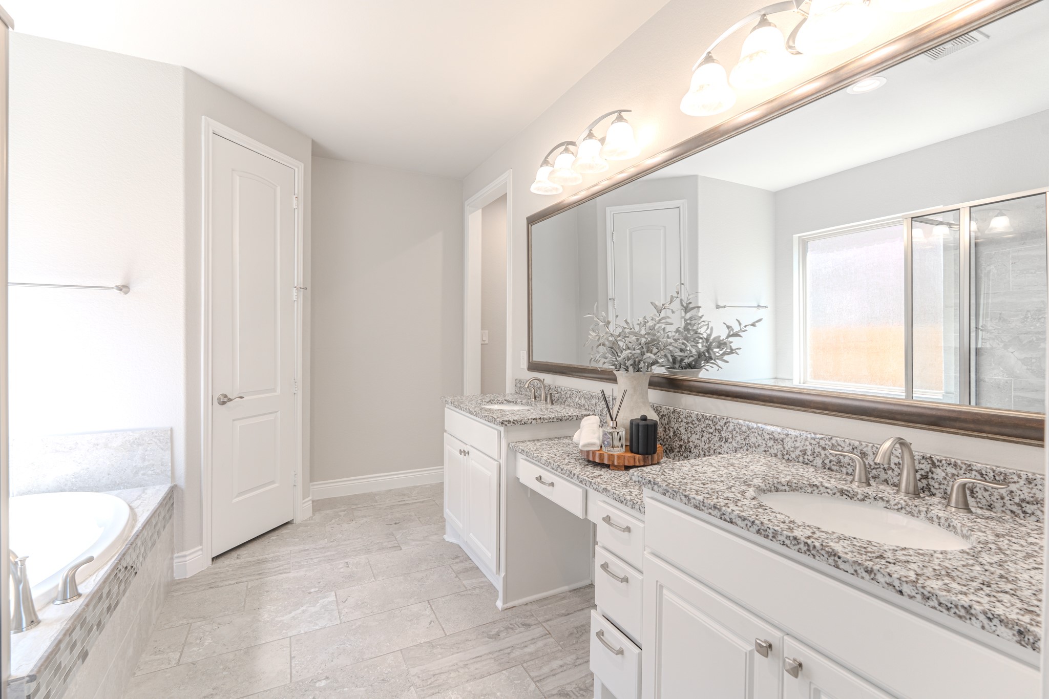 27918 Madison Bend Drive Spring, TX 77386 - Photo 25 of 50 a bathroom with a granite countertop sink and a mirror