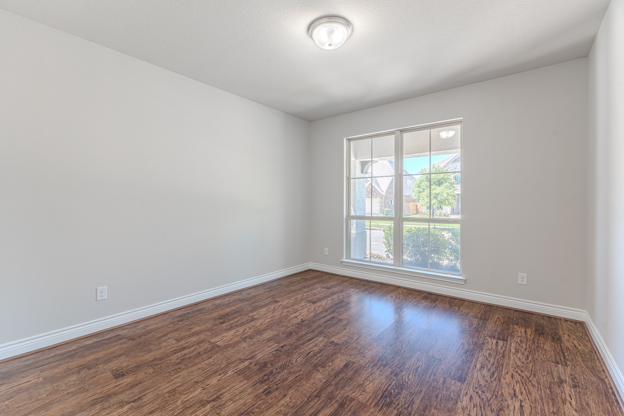27918 Madison Bend Drive Spring, TX 77386 - Photo 29 of 50 an empty room with wooden floor and windows