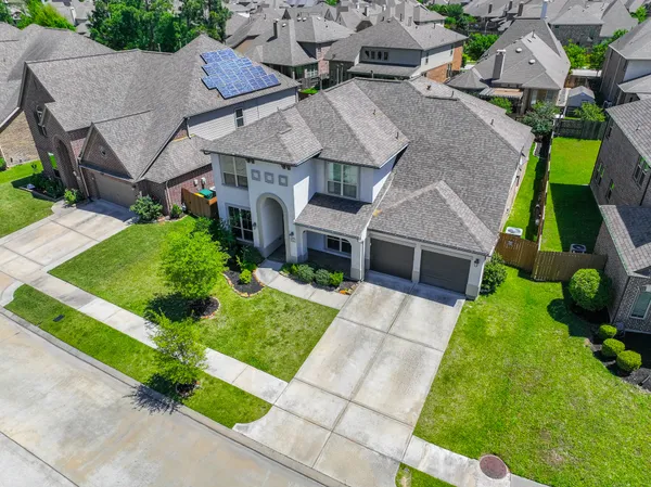 a view of an empty room with glass door and windows