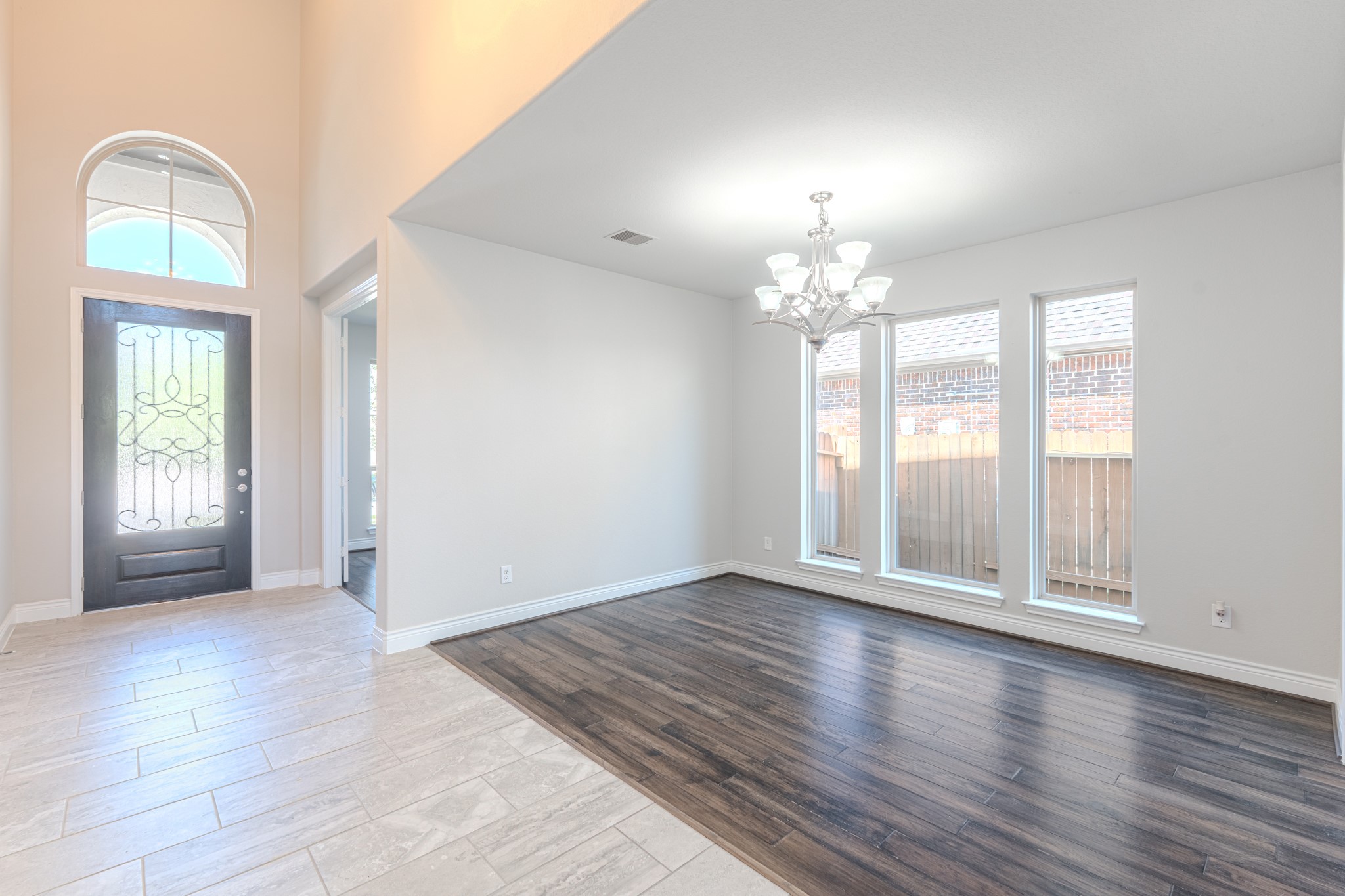 27918 Madison Bend Drive Spring, TX 77386 - Photo 9 of 50 a view of an empty room with wooden floor and a window