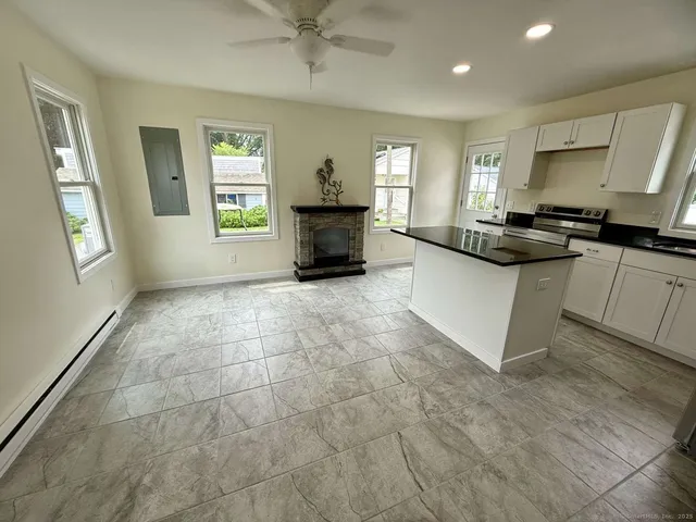a kitchen with a sink cabinets and appliances
